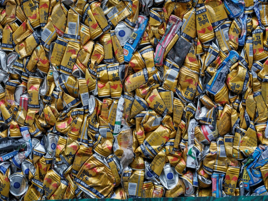 A pile of crushed beverage cans, highlighting recycling and environmental awareness.